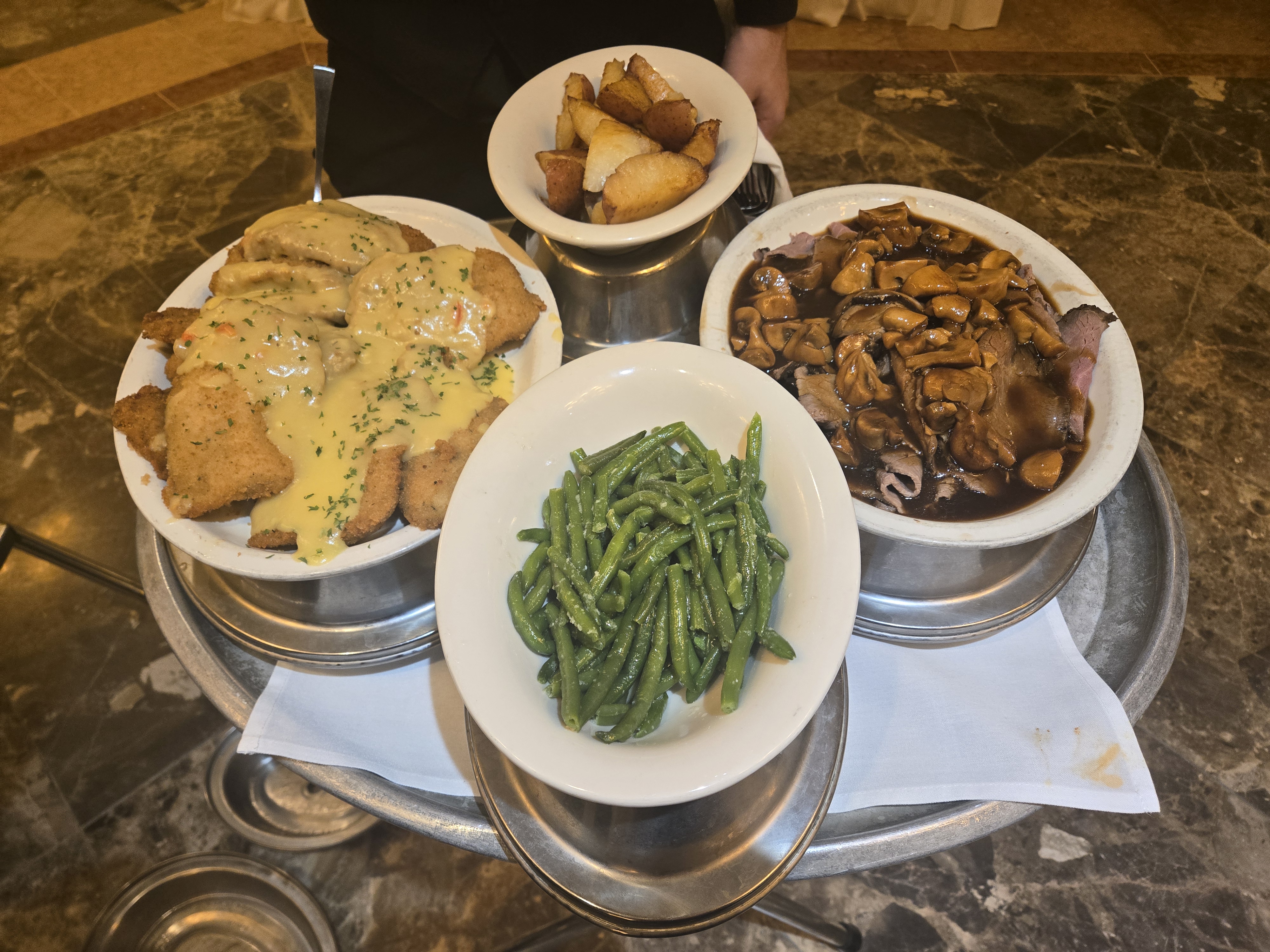 Guests laughing at dinner